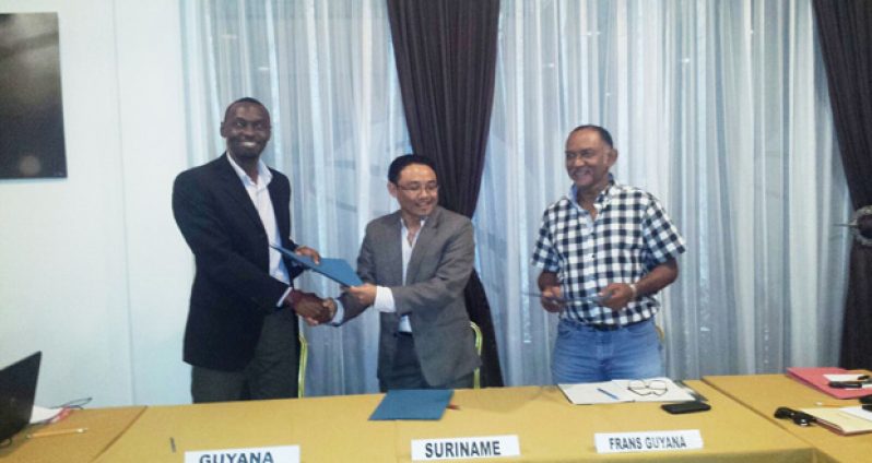 Guyana’s Director of Sport Christopher Jones, Suriname’s Director of Sport Luciano Mentowikromo and French Guiana’s President of Committee of Regional Olympic Sport, following their meeting in Paramaribo.