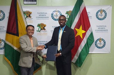 (L-R) Directors of Sport Lunciano Mentowikromo and Christopher Jones with agreement.