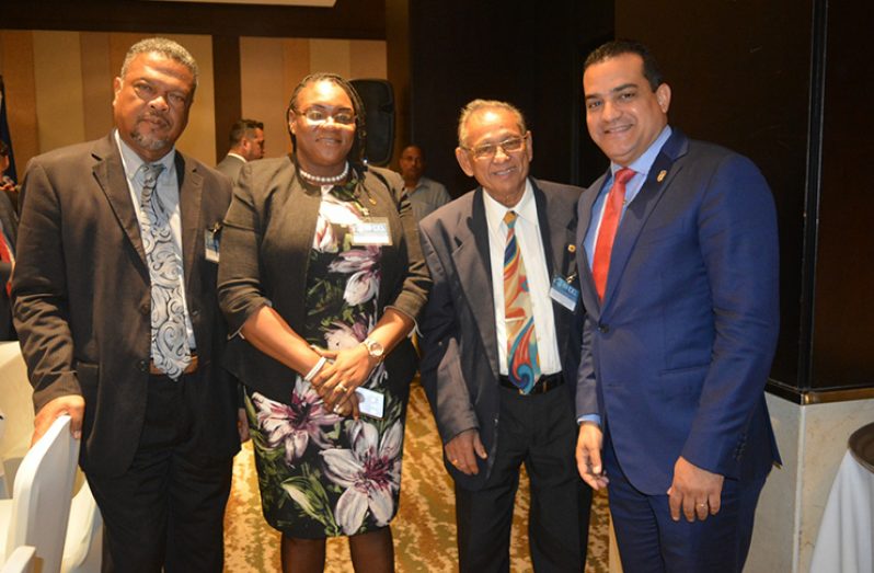 From left: Chief Labour Officer of Guyana, Charles Ogle; President of the Guyana Trades Union Congress, Coretta McDonald and Consultative Association of Guyanese Industry (CAGI) Adviser, Samuel Goolsarran, share a moment with Panama’s Minister of Labour and Labour Development, Luis Ernesto Carles (Navendra Seoraj photo)