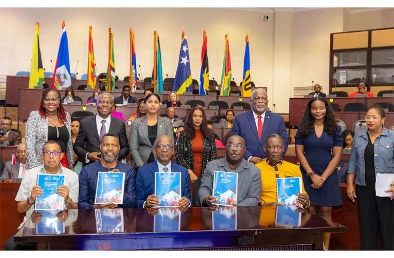 Signatories holding copies of the signed Decent Work Country Programme (DWCP) for Guyana (Caribbean Secretariat photos)