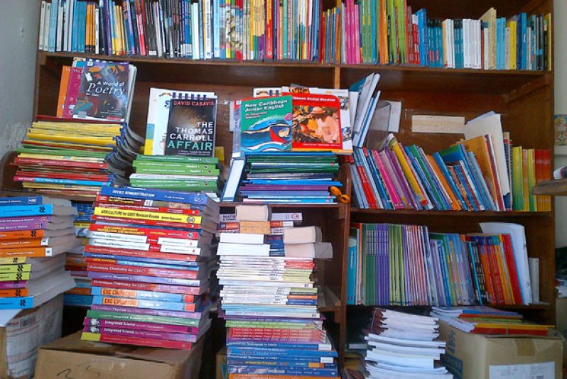 Some of the text books which the now dead Mr. Boodhoo distributed for two international publishers sit on shelves in his office in the lower flat of his Alberttown home.