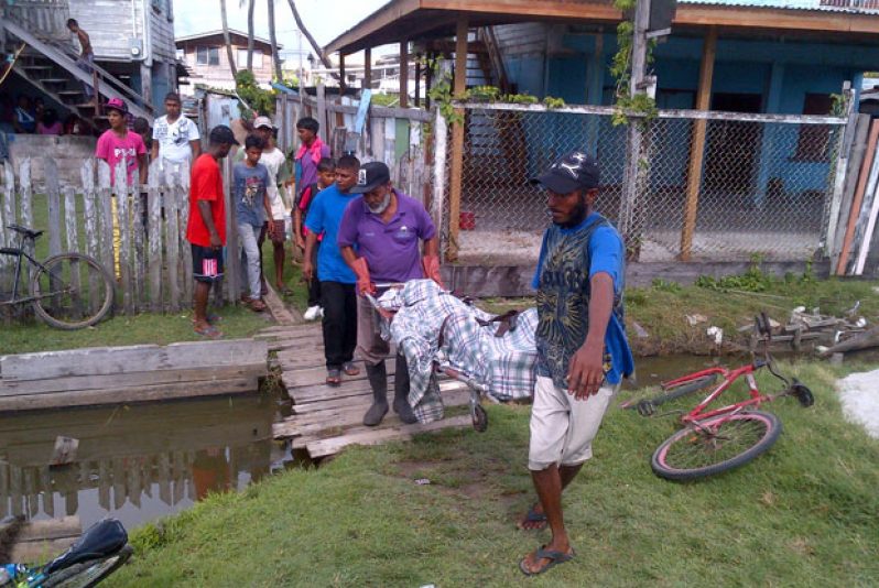 The body of Mohan being removed from his home by Lyken’s undertakers Sunday morning