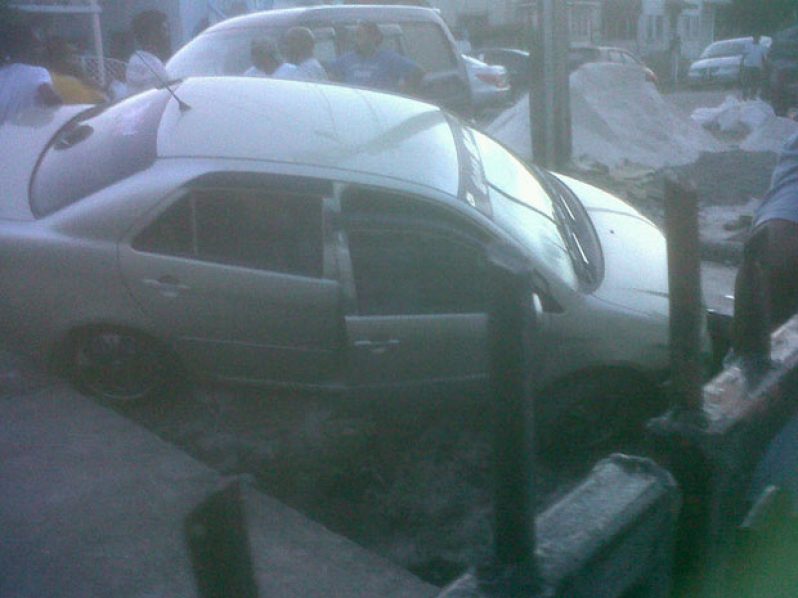 The car in the drain on Station Street, Kitty