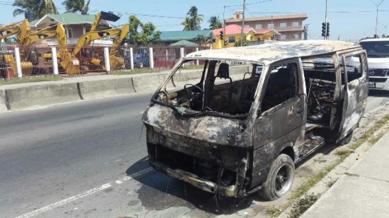 Residents assisted the driver in extinguishing the fire. [Guyana Chronicle Photo]