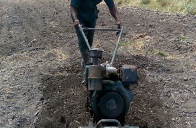 Young farmer Dextor Southwell uses one of his equipment to aid him in the land preparation process