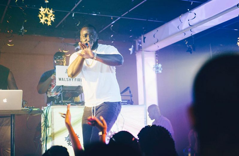 The rising local artiste Dominic “Remar” Weekes on stage performing for his fans.
