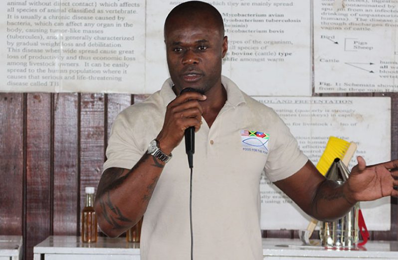Food For The Poor Florida representative, Brinaire Jean, addresses  participants at the launch of the Bee-keeping training programme at Number 59 Village, West Coast Berbice (WCB)