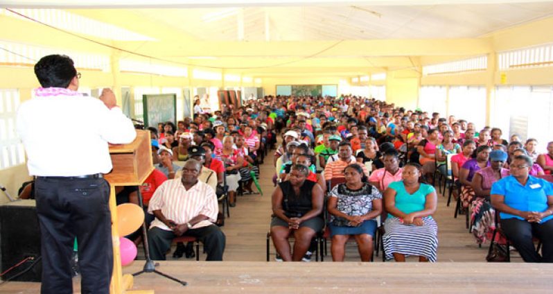AG and Minister of Legal Affairs, Anil Nandlall addressing the hundreds of parents and guardians at the Hope Secondary School on Tuesday