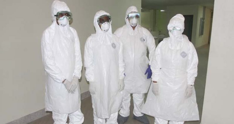 Medical professionals in training, dressed in their protective gear