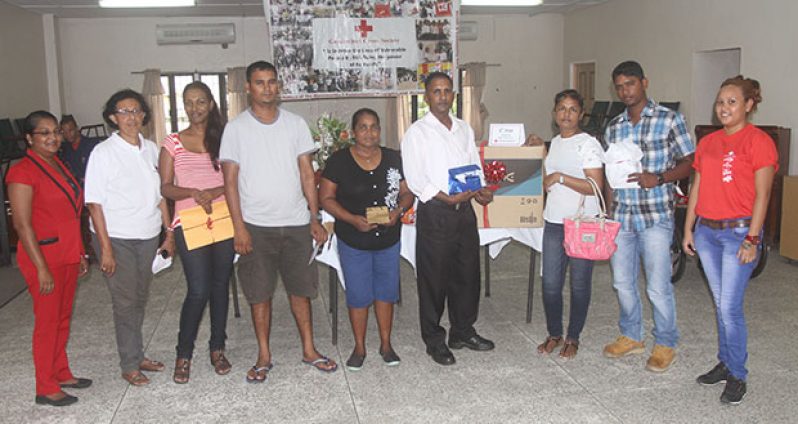 Winners along with representative from the Guyana Red Cross Society pose for this Sonell Nelson photo