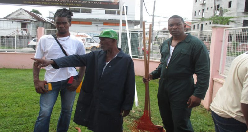 Some persons who participated in GPHC’s cleanup exercise inspecting the work that was done