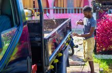 Timon Charles washing his family’s truck (Shaniece Bamfield Photos)