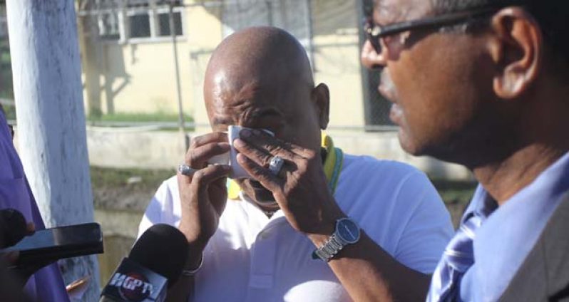 Glenn Lall wipes away the tears Monday outside Force Headquarters, Eve Leary after filing a report there against the Attorney-General