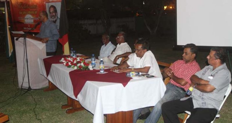 PPP General Secretary Clement Rohee addressing the gathering. At the Head table are, from left: Chairman Kellawan Lall; PYO colleague and close friend of the late Cde. Navin; Neil Kumar; WPO General Secretary Sheila Veerasammy; GAWU General Secretary Seepaul Narine; RPA General Secretary Dharamkumar Seeraj; and longstanding PPP member, Cde. Hydar Ally