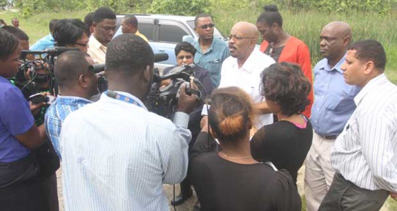 Minister of Local Government and Regional Development, Mr. Norman Whittaker briefing members of the media at Le Repentir Cemetery