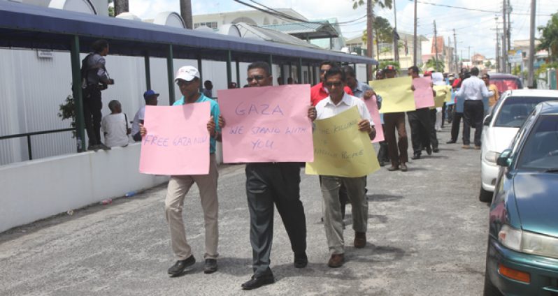 Off to a brisk start: Leading yesterday’s picketing exercise outside the US Embassy are, from left, RPA General Secretary,  Mr Dharamkumar Seeraj; Executive Secretary of the People’s Progressive Party, Mr Zulficar Mustapha; and former Local Government Minister, Mr Harripersaud Nokta (Photos by Sonell Nelson)