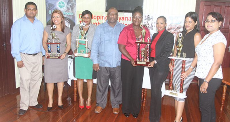 Best Booth winners displaying their awards in company of GTA officials (Photo by Sonell Nelson)