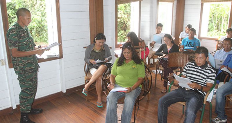 Participants paying keen attention during a training session for tour guides and park wardens