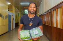 Senior Sales Manager, Roland Beckles-Lamazon with one of the many crops they grow locally at Victoria Greens (Shaniece Bamfield photo)