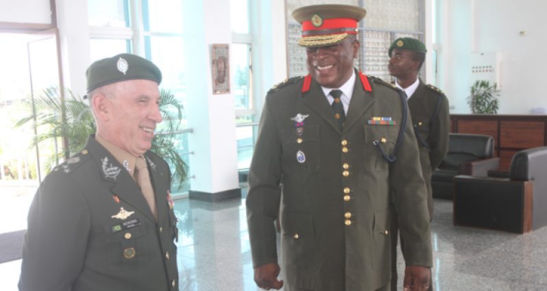 GDF Chief-of-Staff, Brigadier Mark Phillips, shares a light moment with Head of the visiting Brazilian Military delegation, Divisional General, Decio Luis Schons yesterday