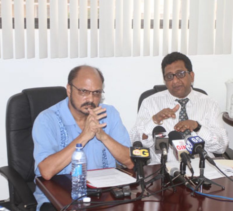 Health Minister, Dr. Bheri Ramsaran and Attorney General, Anil Nandlall addressing the media yesterday (Sonell Nelson photo)