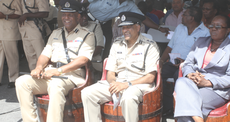 Something laughable catches the attention of outgoing Asst. Commissioner Vyphuis and Acting Police Commissioner Seelall Persaud. Seated at right is Permanent Secretary in the Ministry of Home Affairs, Ms Angela Johnson.