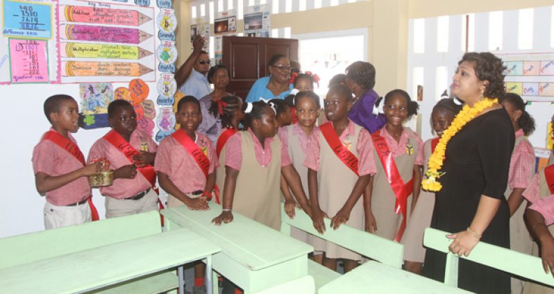 Education Minister, Priya Manickchand with students of St Agnes Primary during her tour of the new building