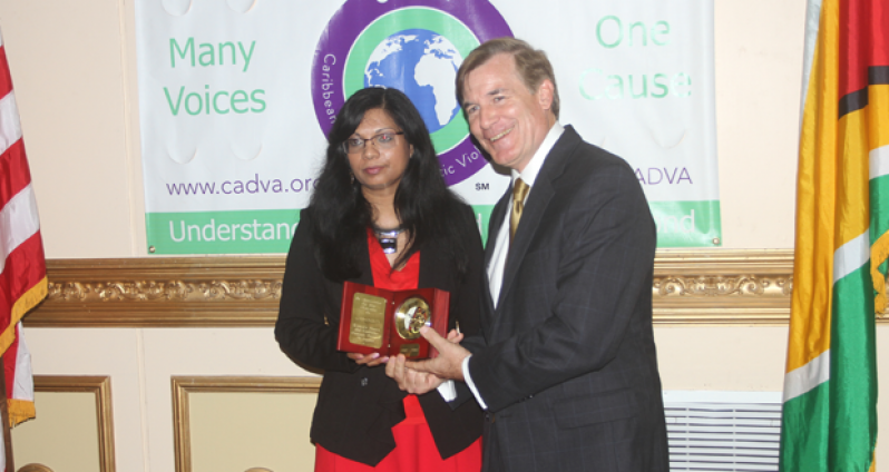 L-R CADVA official, Ms. Diane Madray, presents U.S. Ambassador D. Brent Hardt with a token of appreciation.