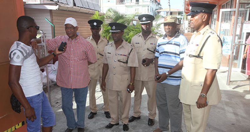 Rohee surrounded by the “A” Division command team as he speaks with the Guyana Chronicle