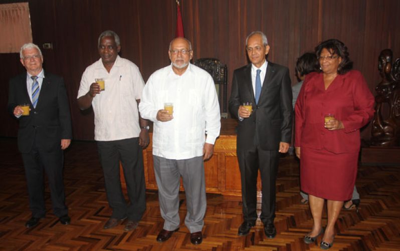 SAVOURING A RARE FRENCH TOAST: Toasting the beginning of even closer ties with France are, from left: Mr Pierre Saint Arroman, French Honorary Consul to Guyana; Public Works Minister, Mr Robeson Benn; President Donald Ramotar; newly-accredited French envoy, Mr Michael Prom; and Ambassador Elisabeth Harper, Director-General of  Guyana’s Ministry of Foreign Affairs. (Photo by Sonell Nelson)