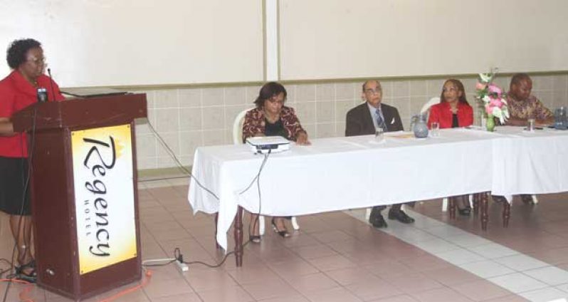 Carnegie Vice Principal, Myrna Lee, in closing remarks yesterday; while seated at the head table is Principal Penelope Harris, Chairman John Seeram, Facilitator Phillipa Morrish and Acting Chief Education Officer (Technical) Patrick Chinedu. (Sonnel Nelson photos)