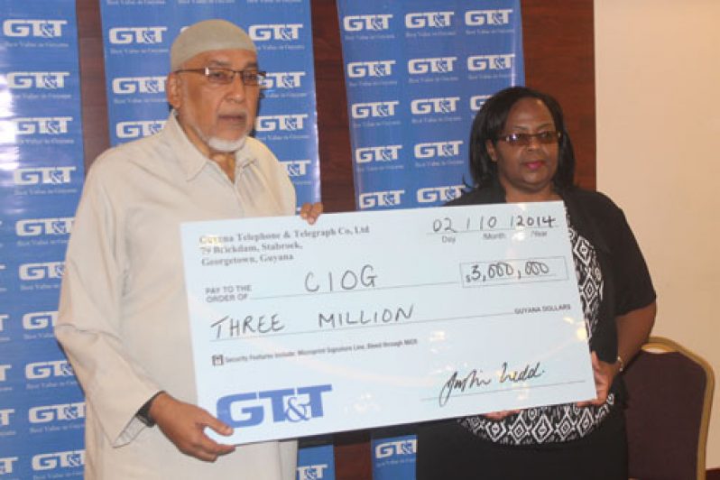 CIOG President, Fazeel Ferouz receiving the symbolic cheque from GT&T Marketing Manager, Fay Wharton (Photo by Sonell Nelson)