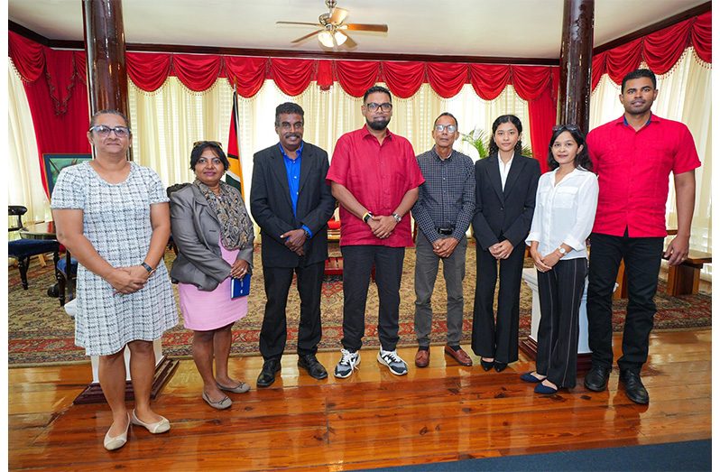 President Irfaan Ali and IKO Guyana Academy head, Jeffrey Wong flanked by Minister of Culture, Youth and Sport, Charles Ramson Jr and IKO officials at State House