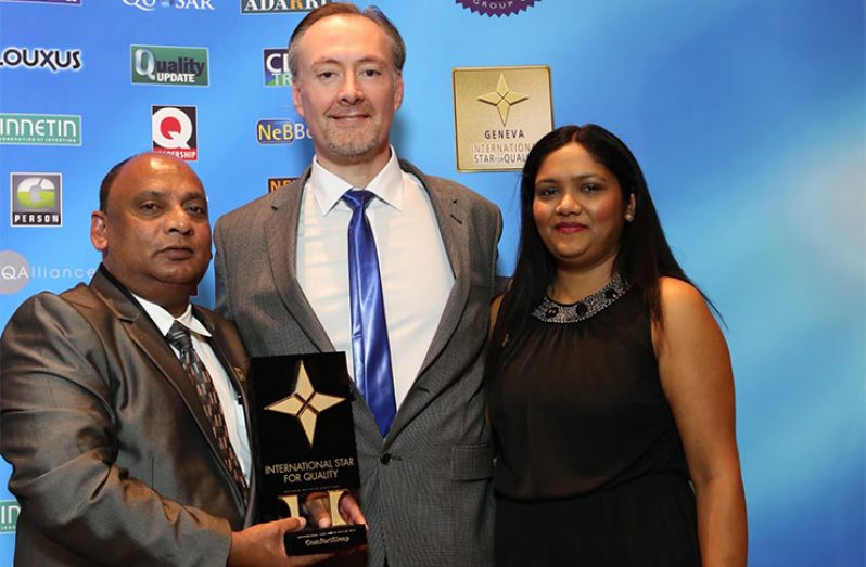 Mr. and Mrs. Dennis Charran with
an official of Business Investment
Development, after receiving the
‘International Star for Quality’
Award in Geneva, Switzerland in
September 2015