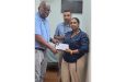 Dr Kumar Sukhraj and wife, of Advance Health Care International, hand over sponsorship cheque to GSCL President Ian John.