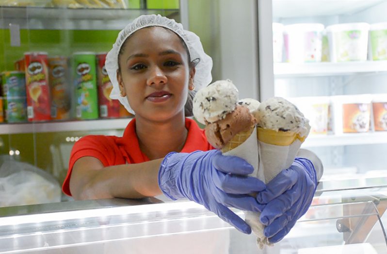 A staff member at the new parlour showcases some of the products