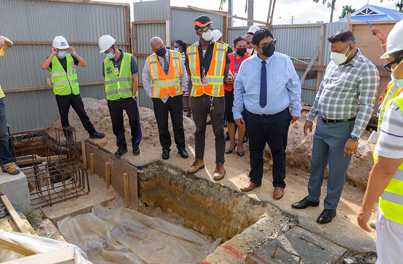 Minister within the Ministry of Public Works, Deodat Indar, and Chairman of the Cheddi Jagan International Airport (CJIA) Board, Sanjeev Datadin, inspecting ongoing works at the airport on Wednesday (Delano Williams photo)