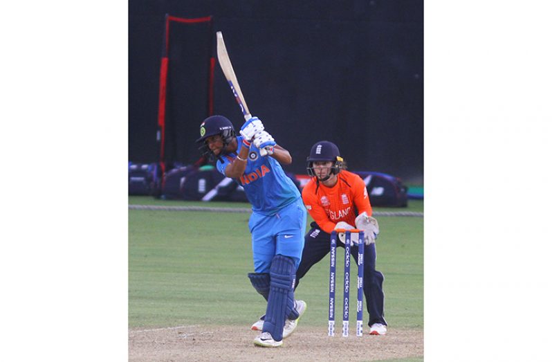 India’s captain Harmanpreet Kaur drives through the offside during her half-century against England in their warm-up match yesterday.