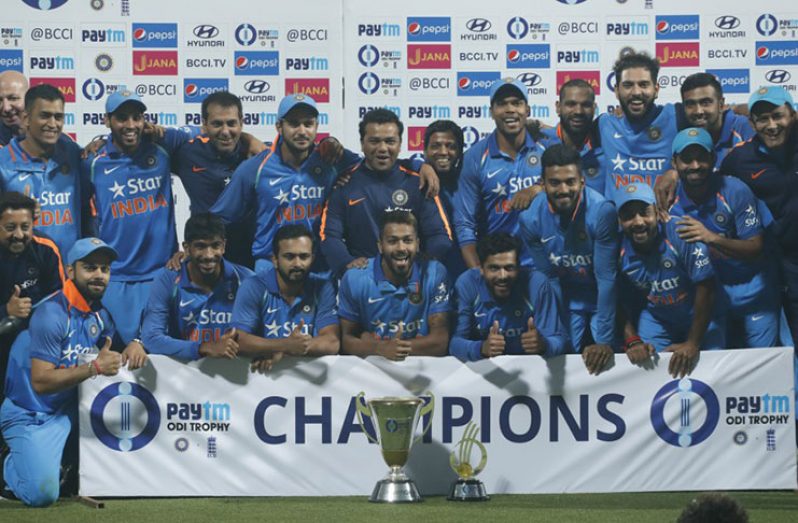 India's ODI squad and support staff celebrate a 2-1 series win over after the  3rd ODI in  Kolkata.