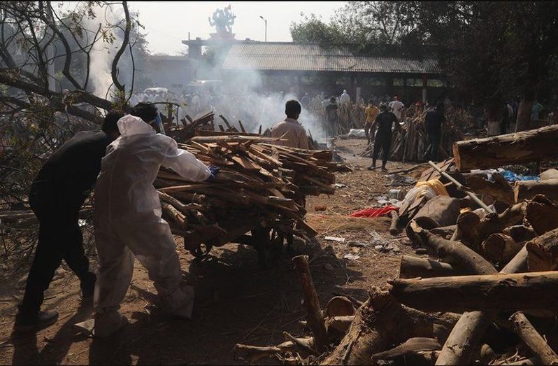 Relatives of coronavirus victims have been collecting wood for use in makeshift funeral pyres (Photo courtesy of Getty Images)