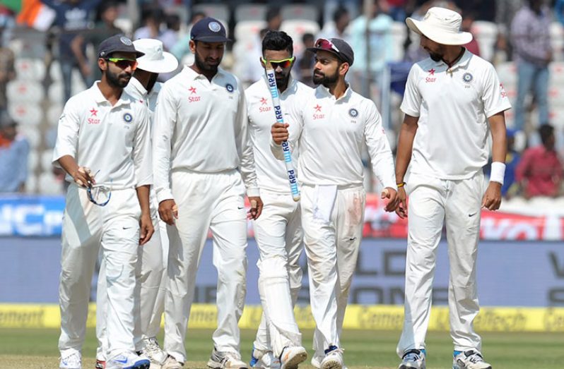 Virat Kohli leads India off the field following their big win over Bangladesh on the fifth day in Hyderabad.