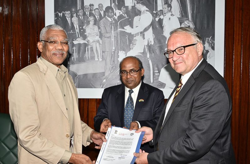 President David Granger receiving the official invitation from Indian High Commissioner, Mr. Venkatachalam Mahalingam and Ambassador of the French Republic to Guyana, Mr. Antoine Joly