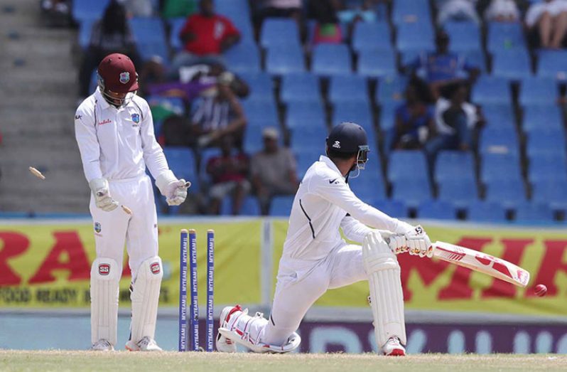 KL Rahul is bowled attempting the sweep. (Associated Press)