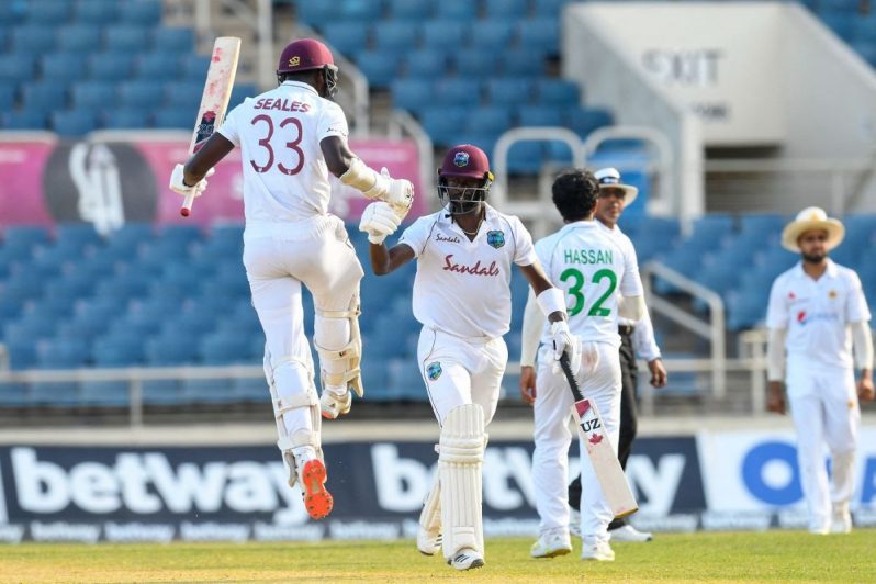 Jayden Seales and Kemar Roach bump fists after the winning runs, West Indies vs Pakistan, 1st Test, Kingston, 4th day, August 15, 2021 © AFP/Getty Images