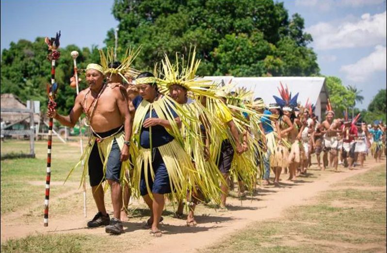 Indigenous people of Guyana celebrating their rich heritage which is enjoyed by tourists visiting the villages