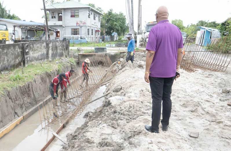 Minister of Public Works, Bishop Juan Edghill inspecting the ongoing drainage works of the ‘E’ Field road project