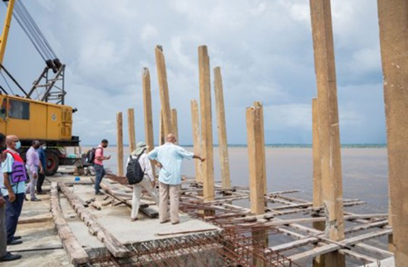 Public Works Minister, Bishop Juan Edghill, inspecting works at the Bartica stelling