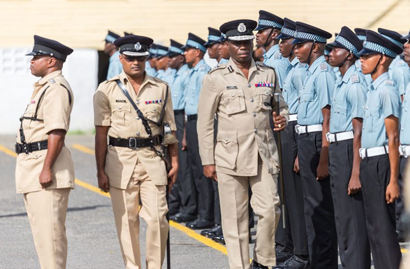 Commissioner of Police Leslie James inspects the parade before the formal ceremony. (Delano Williams photo)