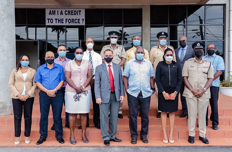 Home Affairs Minister, Robeson Benn (third from right), flanked by Adviser, Harry Gill and Permanent Secretary, Mae Toussaint Jr. Thomas, along with law enforcement heads