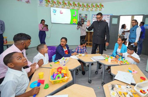 President Dr. Irfaan Ali, interacting with leaners at the Exceptional Learners Centre, also known as the Special Education Needs (SEN) Unit, in Region Two
